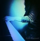 Picture of Ruth Pheasant at the Piano With Blue Spotlight