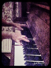 Two Hands Playing Piano