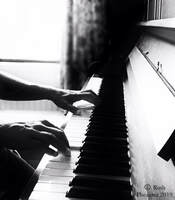 Picture of piano teacher playing the piano